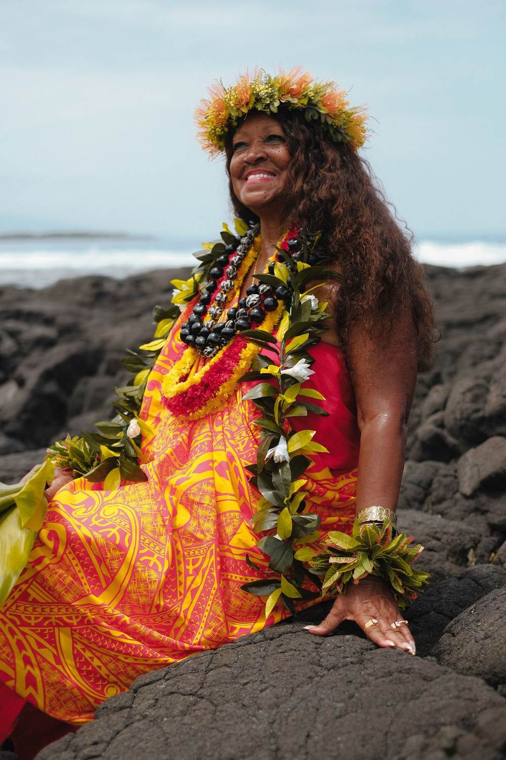 Kahu Kāhealani seated on the lava shore